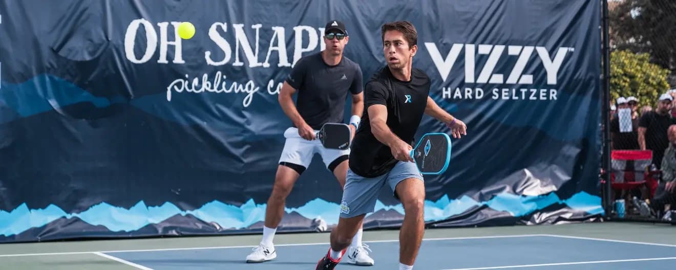 Zane Navratil hits a backhand.