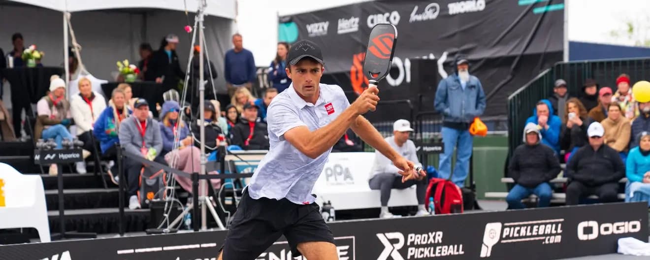 James Ignatowich hits a pickleball forehand.