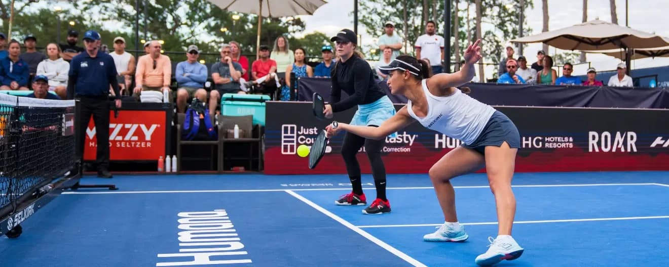 Jackie Kawamoto and Vivienne David playing pickleball.