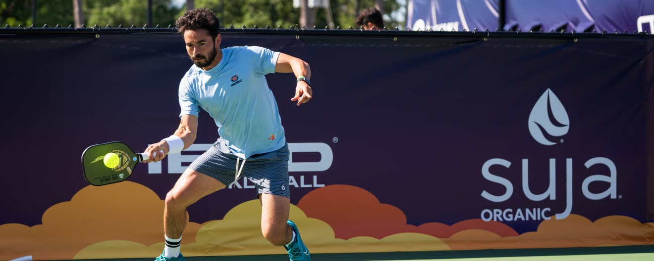 Noe Khlif hits a pickleball forehand.