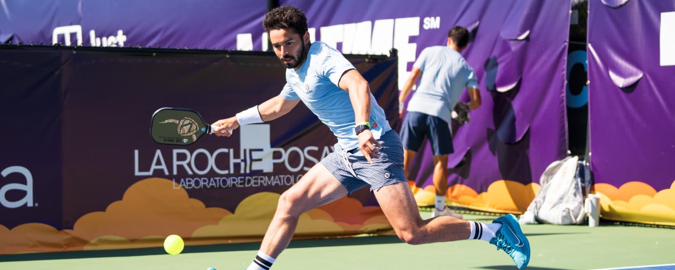 Noe Khlif hits a pickleball forehand.