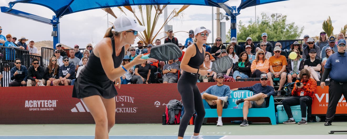 Mary and Maggie Brascia playing pickleball doubles.