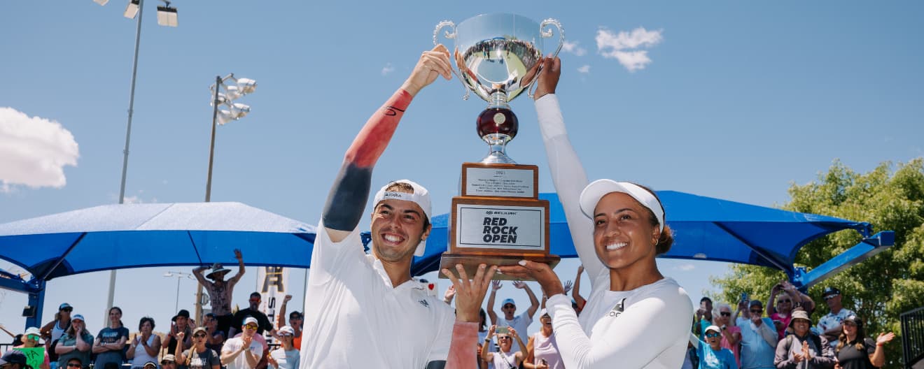 Etta Wright and Ben Johns hold the trophy at the Selkirk Red Rock Open.
