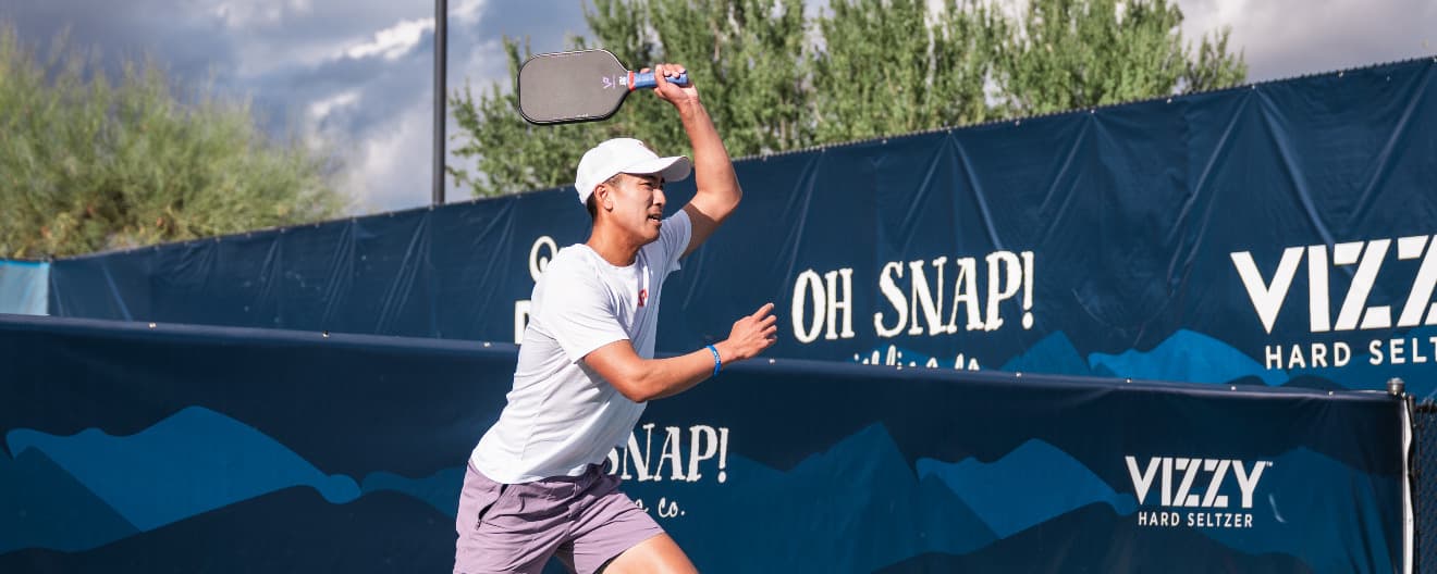 Augie Ge hits a pickleball forehand.