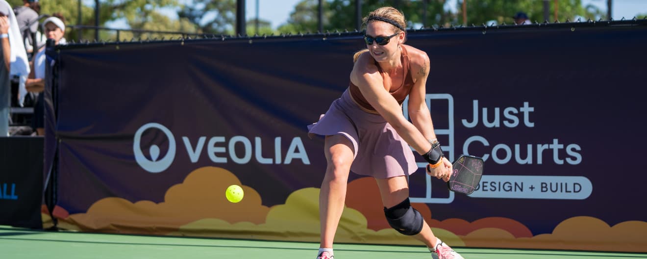 Christine Maddox hits a pickleball backhand.