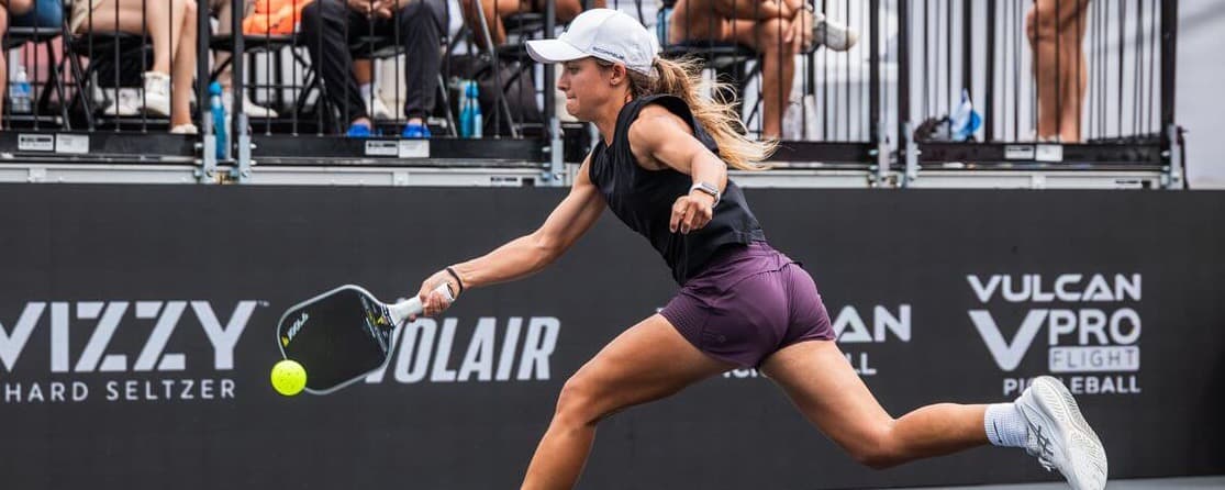 Lacy Schneemann lunging for a ball
