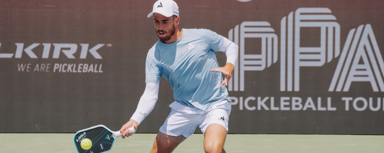 Federico Staksrud hits a pickleball forehand.