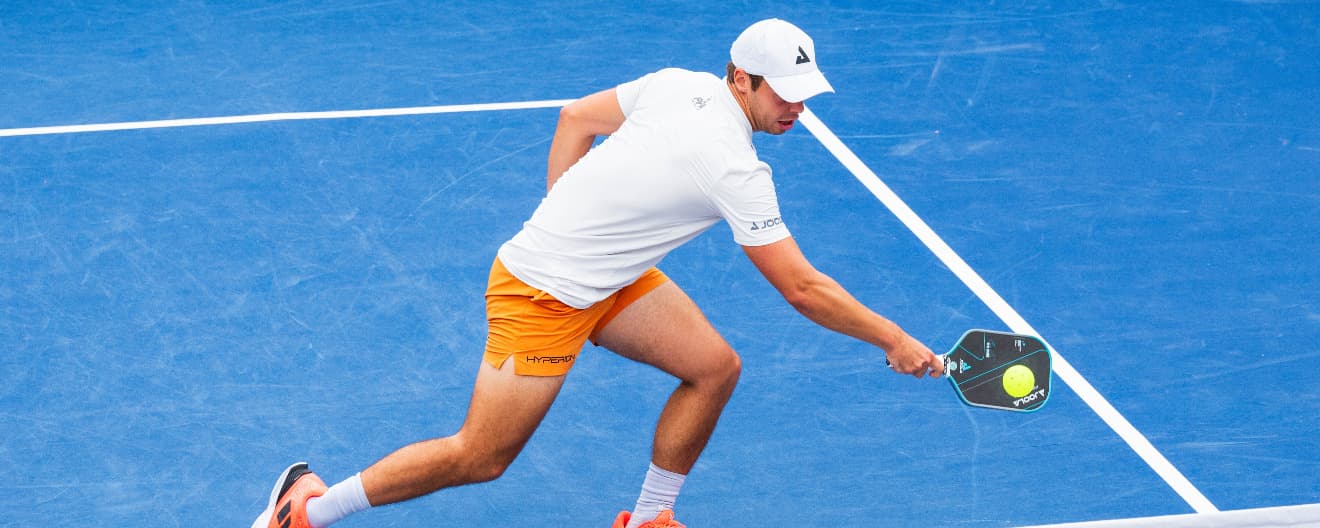 Ben Johns hits a pickleball backhand.