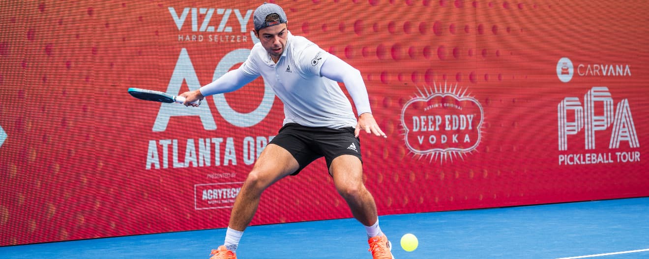 Ben Johns hits a forehand.