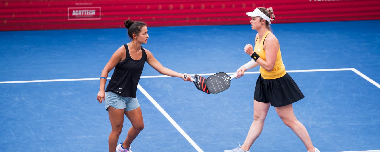 Jade Kawamoto and Andrea Koop celebrate a point.