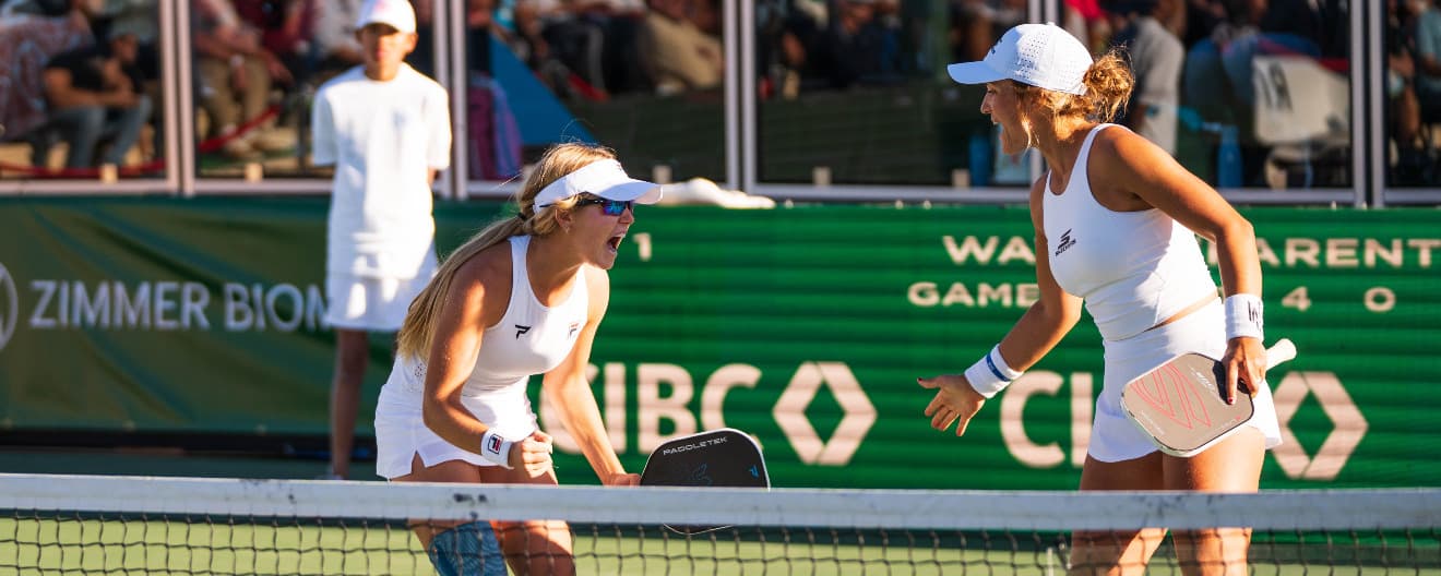 Anna Leigh Waters and Catherine Parenteau celebrate a point at the Masters.
