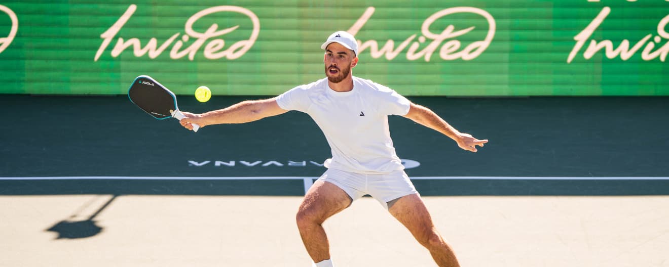 Federico Staksrud hits a forehand volley.