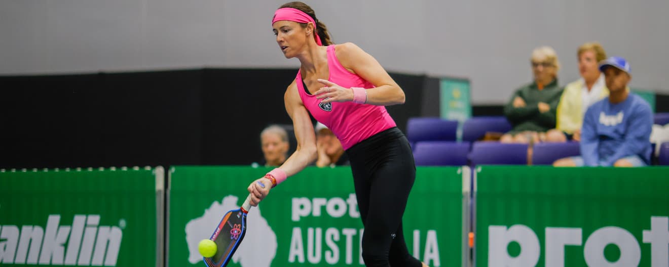 Kaitlyn Christian hits a pickleball forehand.