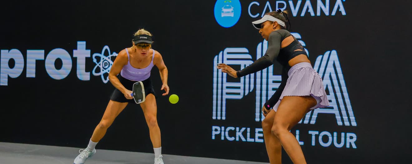 Tyra Black and Allyce Jones playing women's doubles.