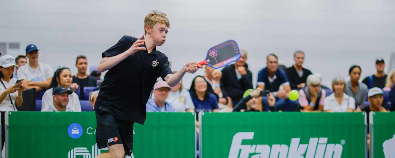 CJ Klinger hits a forehand.