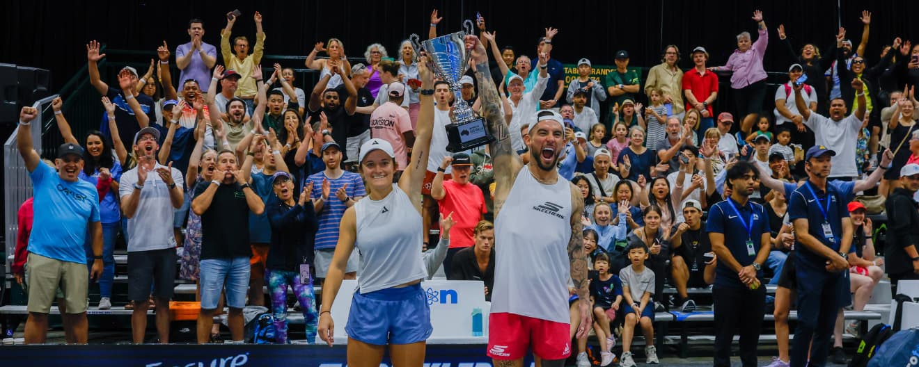 Lacy Schneemann and Tyson McGuffin with their mixed doubles trophy.