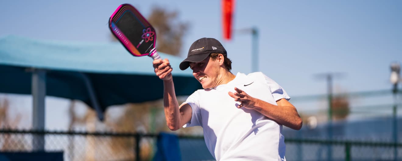 Tom Evans hits a forehand.