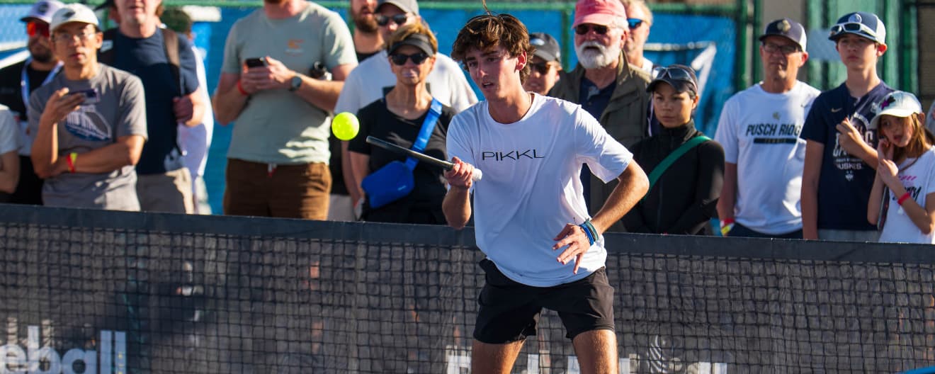 Gabe Tardio hits a forehand.