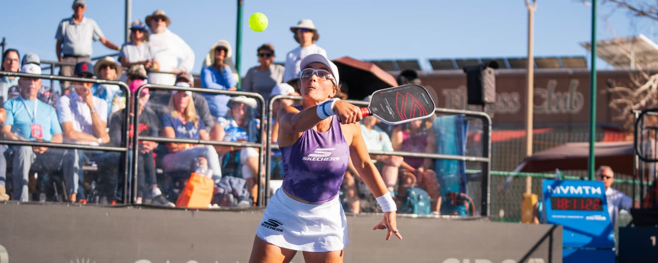 Catherine Parenteau hits a backhand volley.