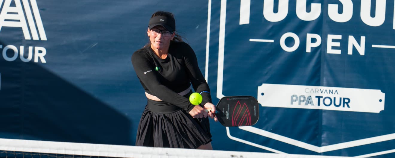 Rachel Rohrabacher hits a backhand.