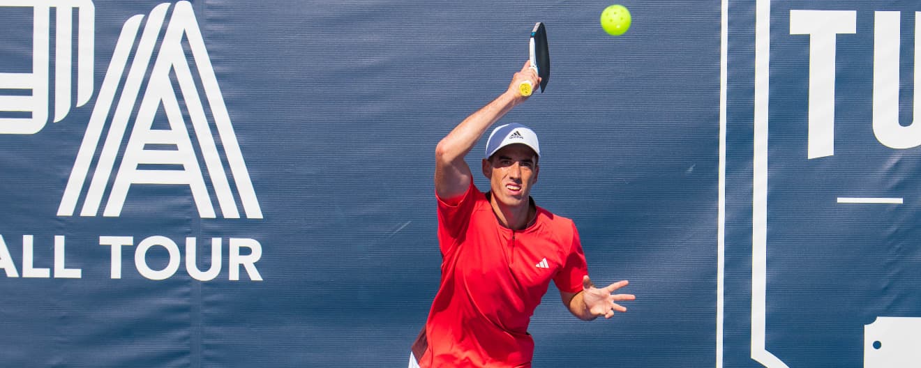 Federico Staksrud hits a forehand.