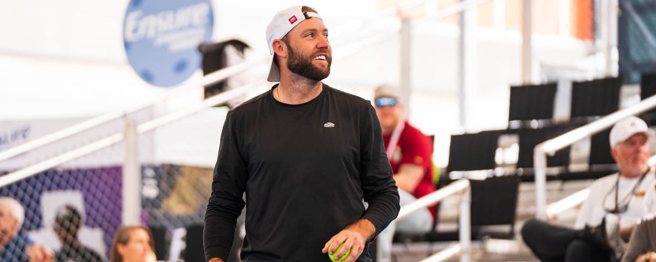 Jack Sock smiling in between points.