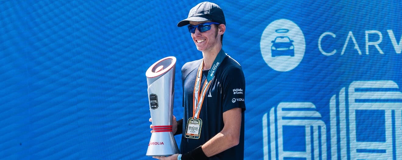 John Lucian Goins celebrating his men's singles title at the Veolia Bristol Open.