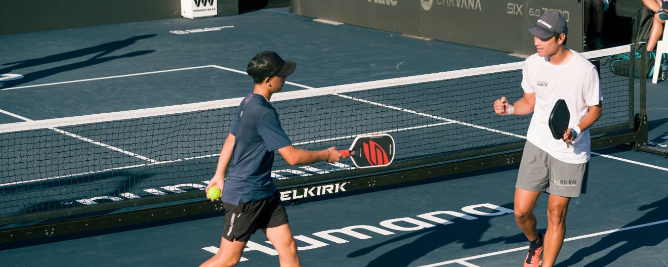 Tama Shimabukuro and Yuta Funemizu playing pickleball doubles.