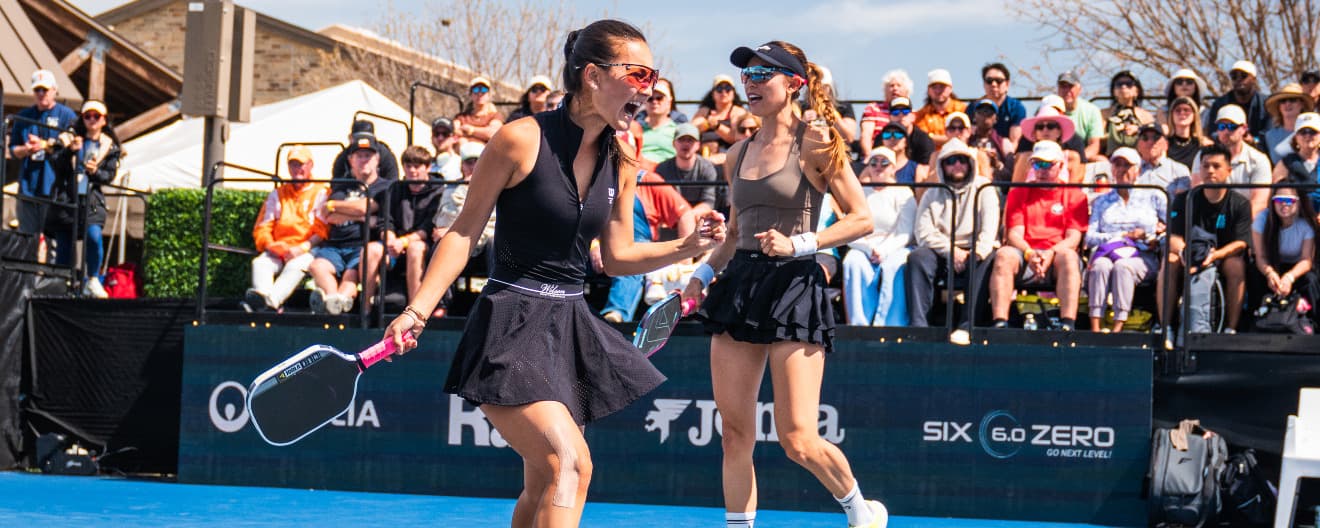 Alix Truong and Parris Todd playing pickleball women's doubles.