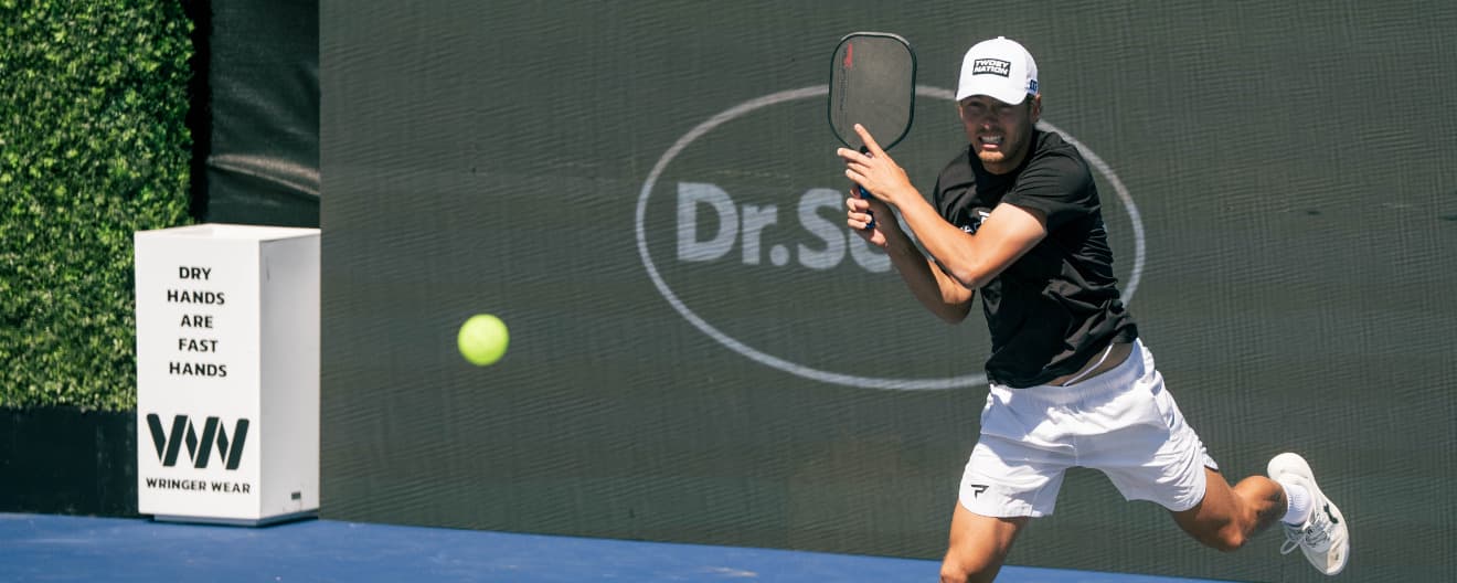 Connor Garnett hitting a pickleball backhand.