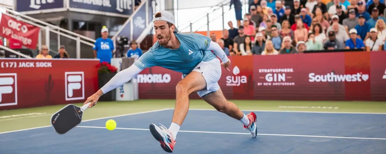 Federico Staksrud hits a forehand.