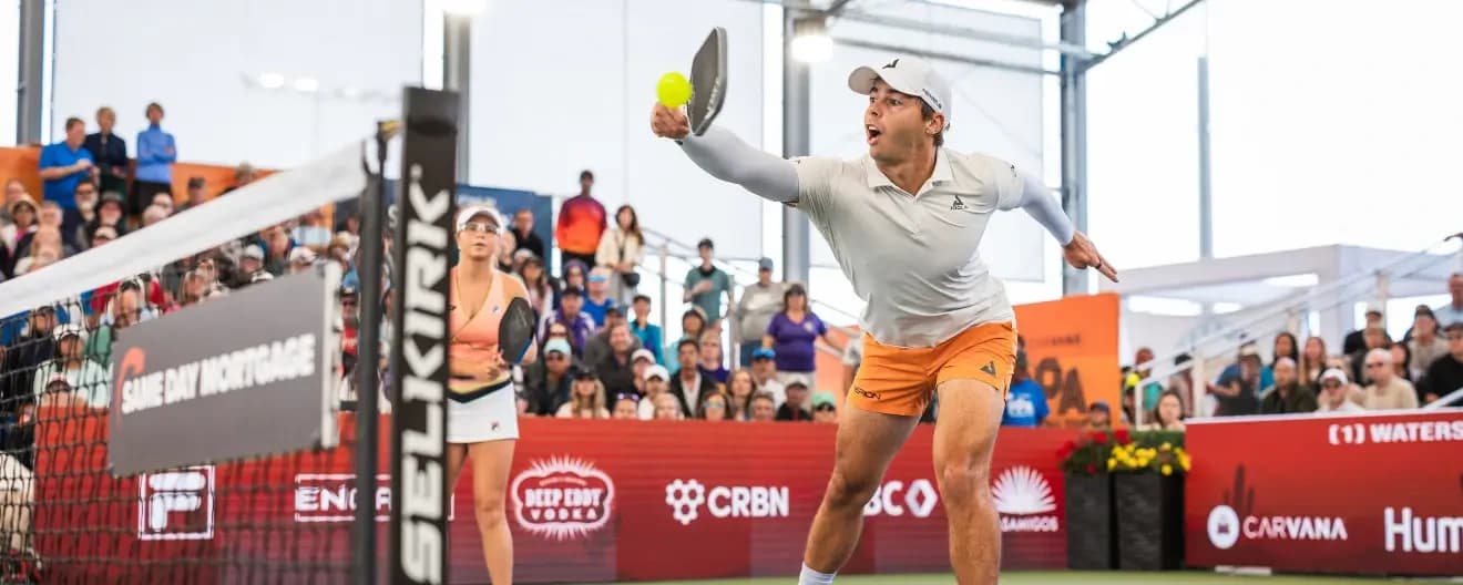 Ben Johns hits a backhand volley at the Mesa Arizona Cup.