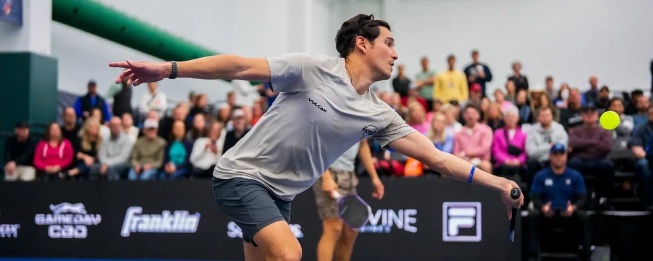 Tyler Loong hits a forehand volley.