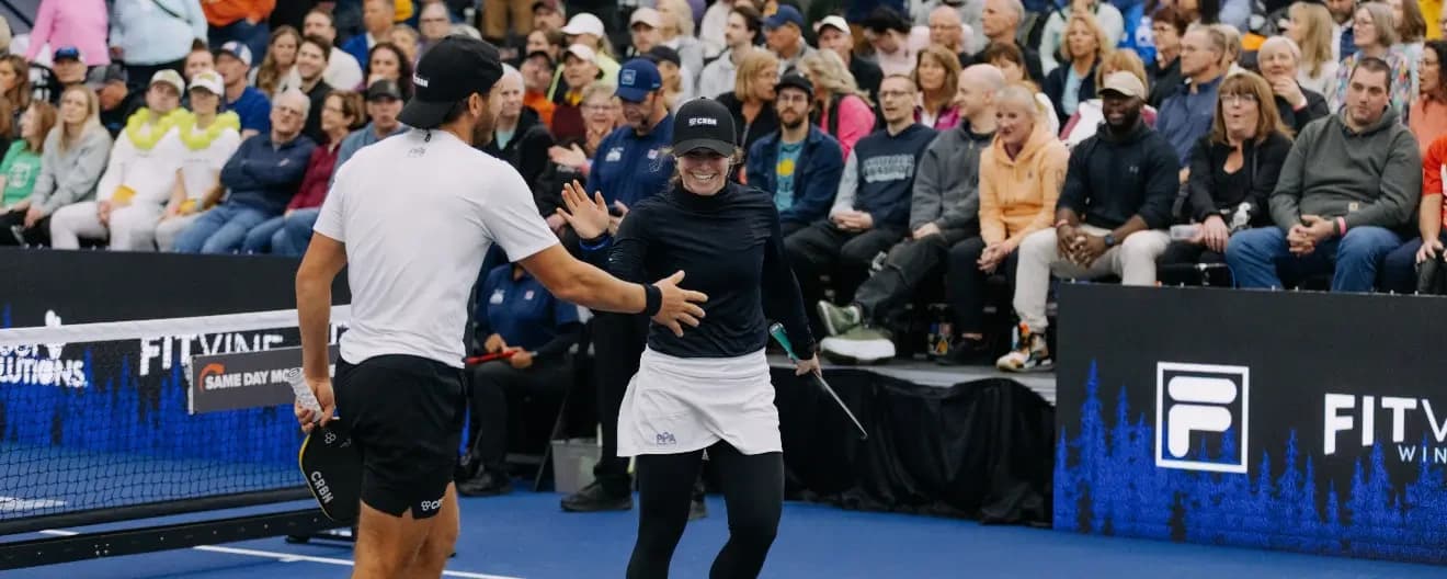 Thomas Wilson and Vivienne David celebrate a point at the Pickleball Central Indoor USA Championships.