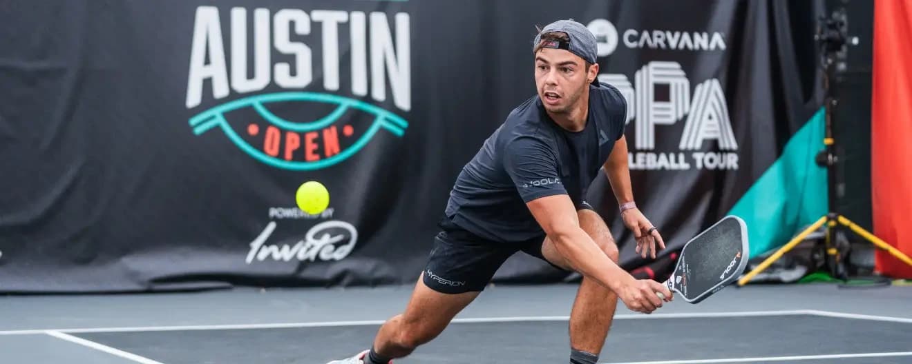 Ben Johns hits a backhand in pickleball.