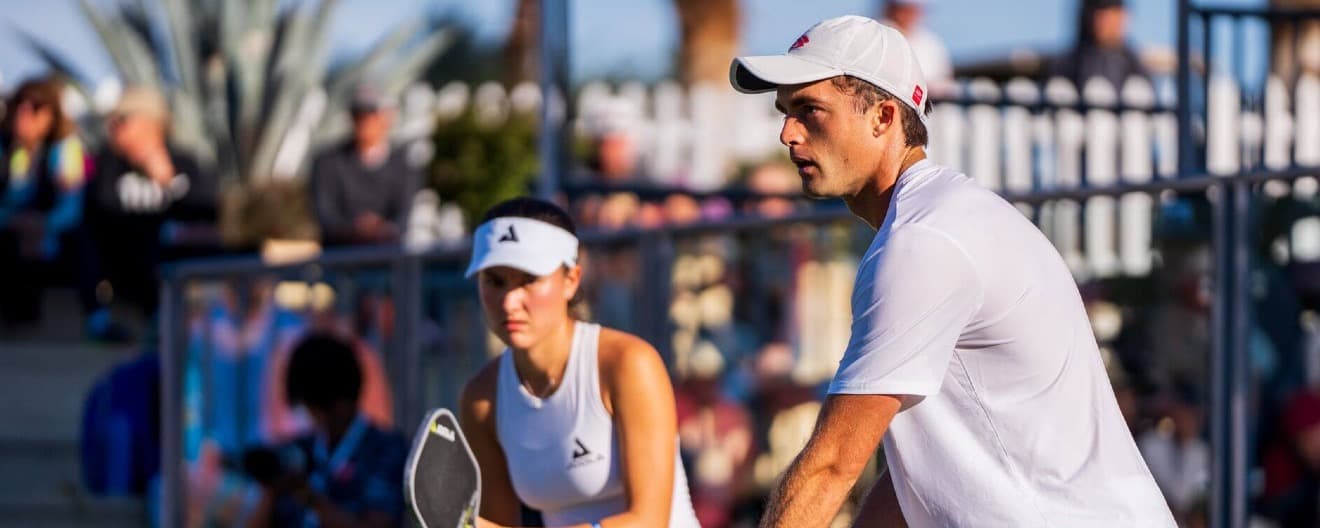 James and Anna playing pickleball together in mixed doubles.