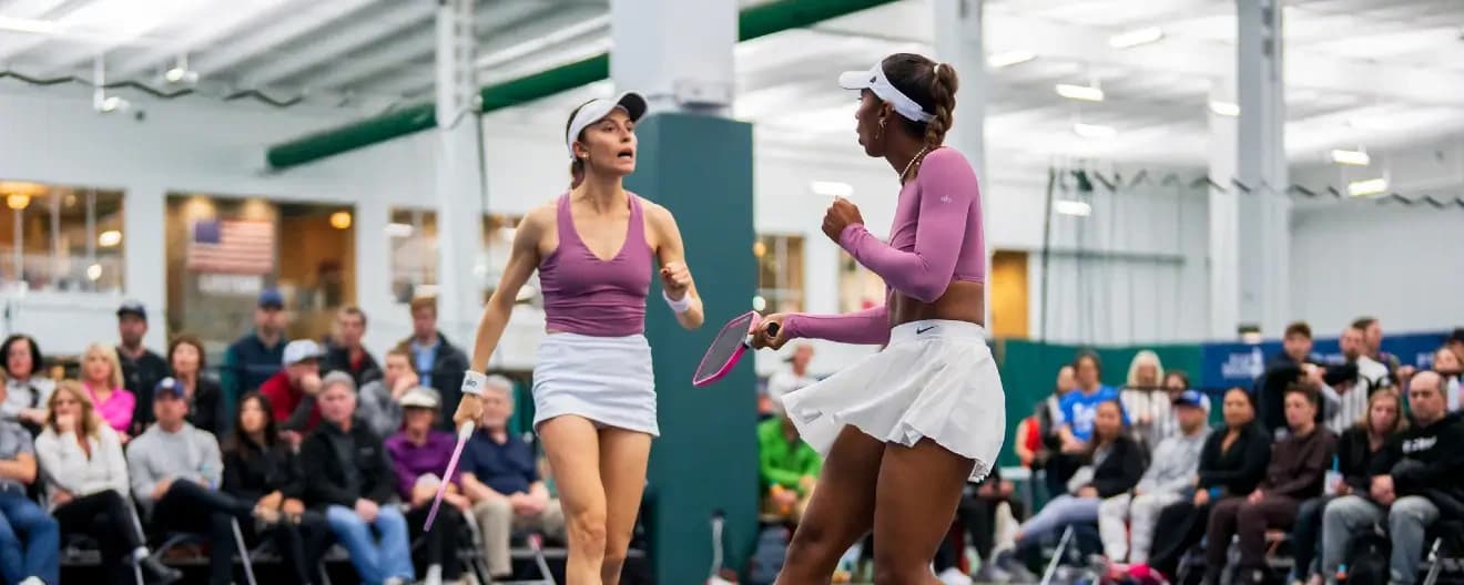 Parris Todd and Hurricane Tyra Black celebrate a pickleball point.