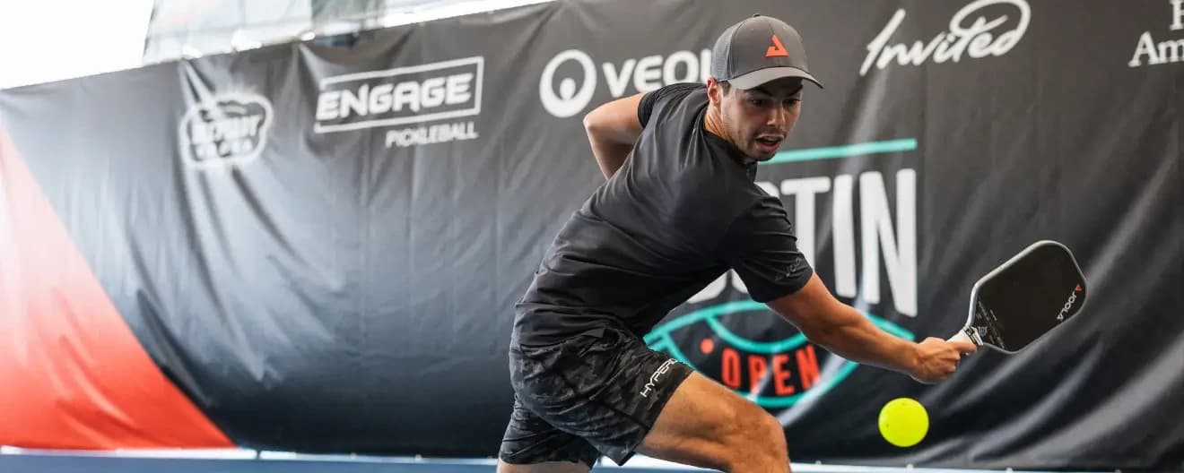 Ben Johns hits a pickleball backhand.