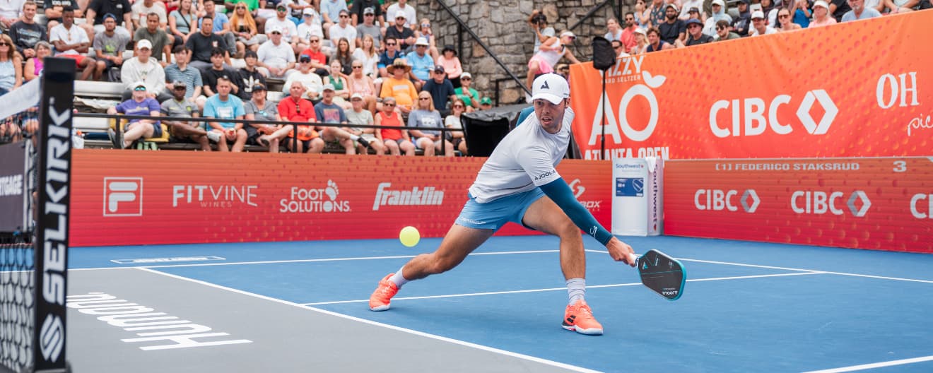 Ben Johns hits a backhand.