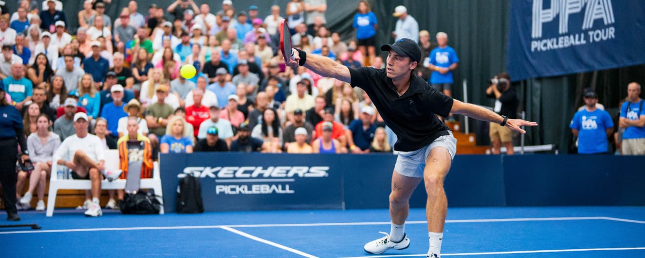 Christian Alshon hits a backhand in front of a full crowd.