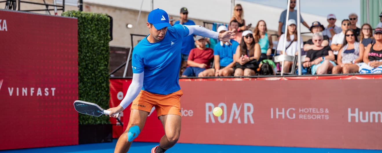 Ben Johns hits a forehand.
