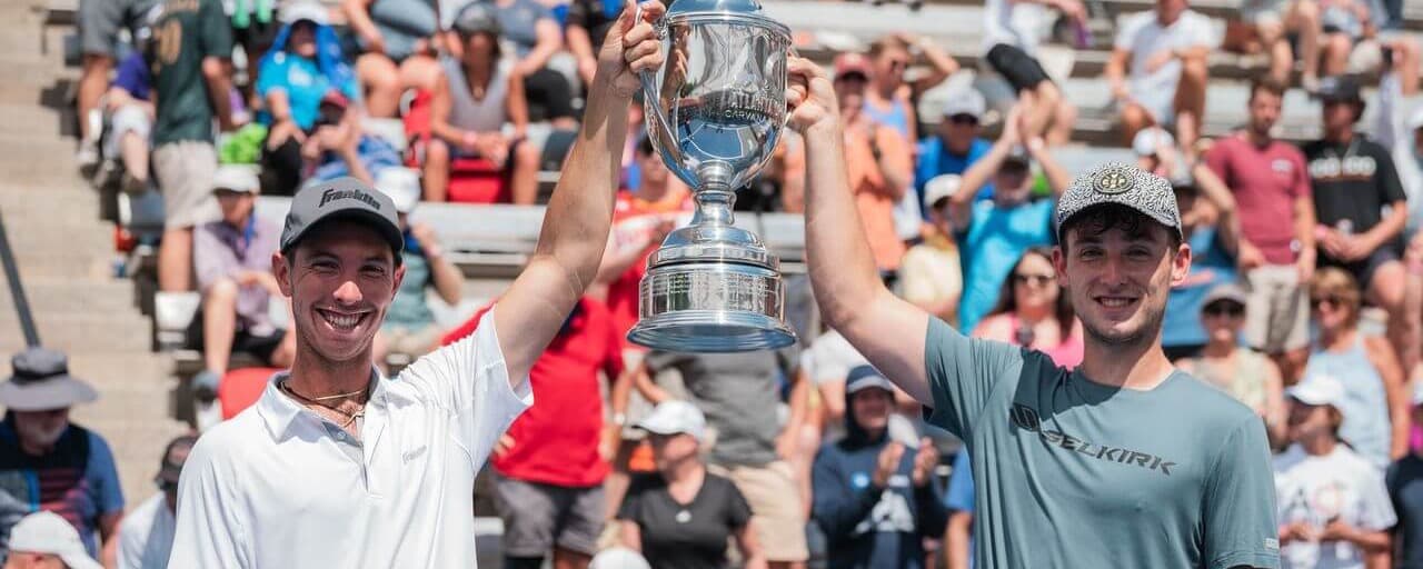 JW Johnson and Dylan Frazier holding up a trophy