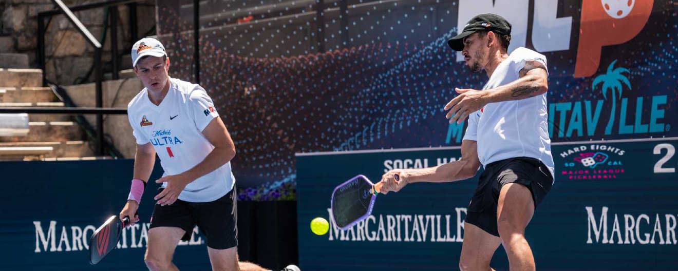 Jaume Martinez Vich and Todd Fought playing men's doubles.