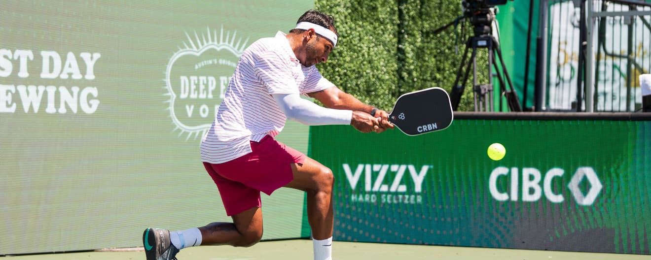 Naveen Beasley hits a backhand.