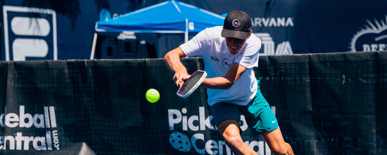 Tom Evans hits a backhand.