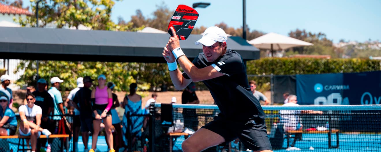 Chris Haworth hits a backhand.