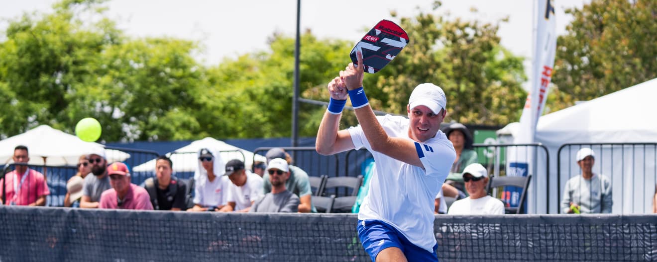 Chris Haworth hits a backhand.