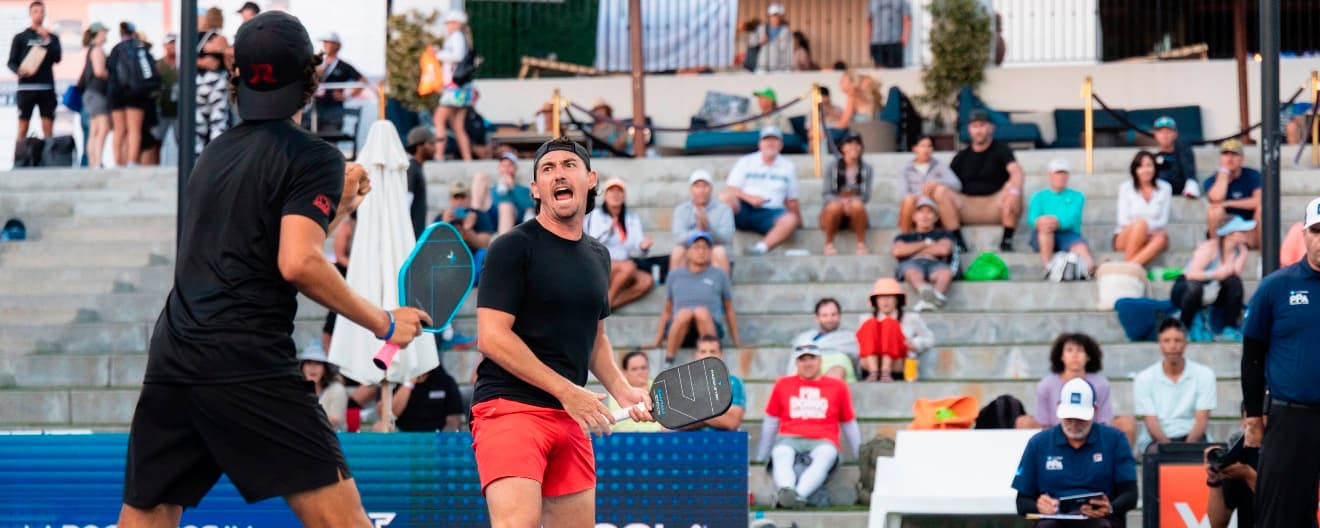 Jack Munro and Julian Arnold celebrate a doubles victory over Matt Wright and Federico Staksrud on Friday.