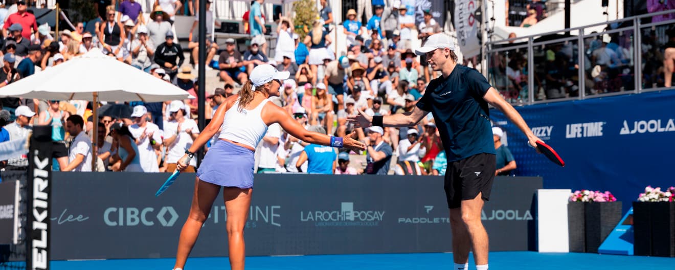 Catherine Parenteau and Christian Alshon celebrate a victory.