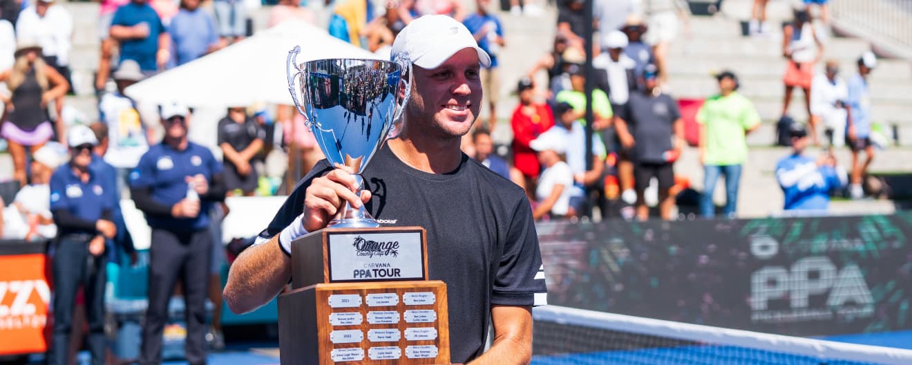 Chris Haworth holding the championship trophy.
